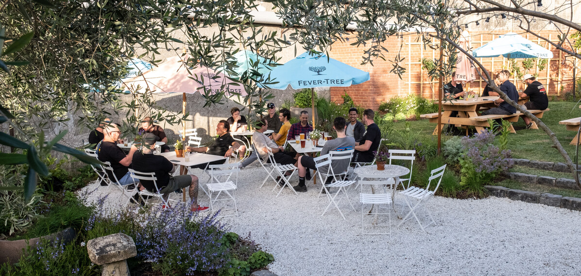 Recycled basalt kerb stones link two garden terraces and stitch together abundant garden beds. A social platform for meeting friends and whānau.