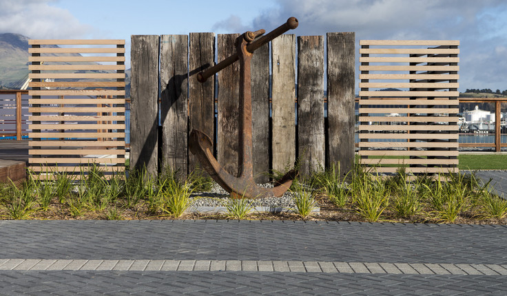 An anchor was also donated and takes pride of place in the main yard, lit up at night with the lights of the working port behind. Photo by CMG Studios