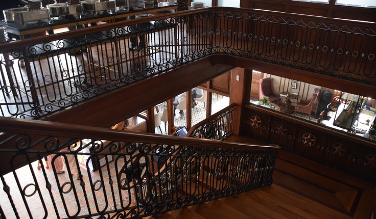 The stairway leading past a café to the meeting room