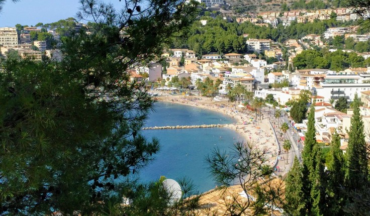 Sheltered bay popular for things nautical, accessed through a narrow pass from Soller, Mallorca