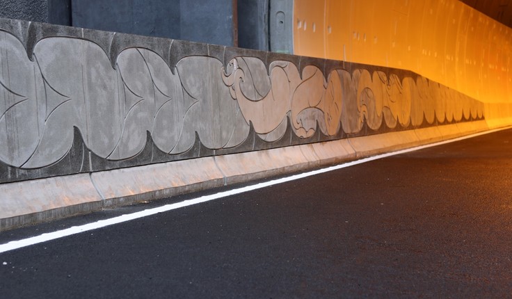 Cast concrete artwork designed by artist Graham Tipene of Ngati Whatua Orakei in Auckland. The panels tell the story of two lovers – Hinemairangi and Tamaireia – who escaped underground