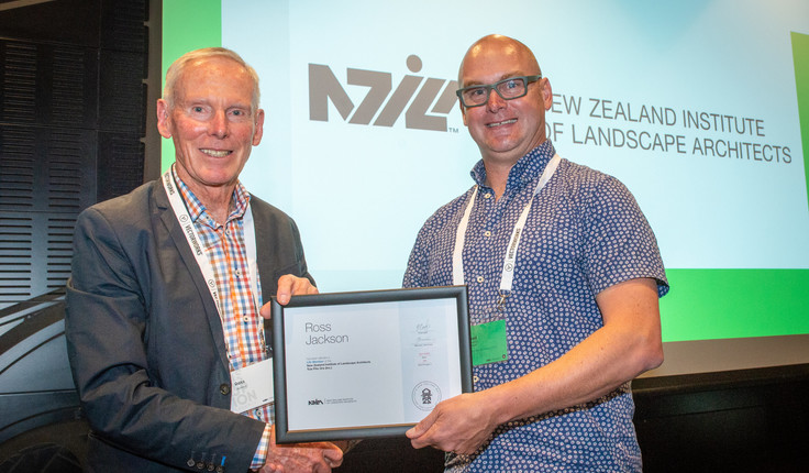 NZILA President Brad Coombs presents Ross Jackson with his life membership.