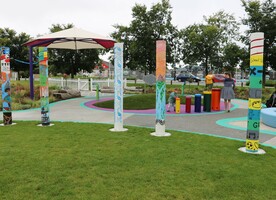 Children from schools in the region painted the pou in the playground.