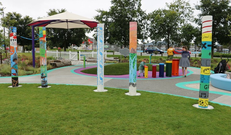 Children from schools in the region painted the pou in the playground.