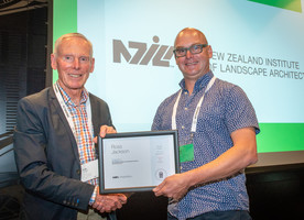 NZILA President Brad Coombs presents Ross Jackson with his life membership.