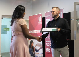 Aachna Aachal receiving the Frank Boffa Award for overall excellence in a final year student from Matthew Jones (NZILA Auckland Branch Chair)